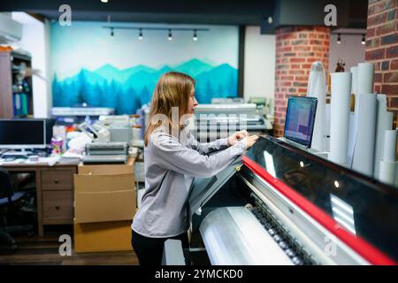 Woman working in printing studio Stock Photo