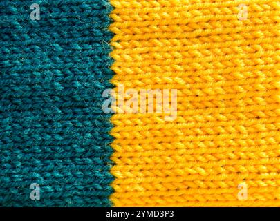 Texture of a knitting pattern made from wool yarn. Close-up of a satin stitch pattern. Stock Photo