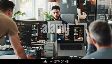 Man, developer and programmer with computer for coding solutions, problem solving or ideas at office. Male people, designers or employees working on Stock Photo