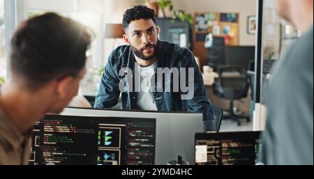 Men, discussion and meeting with computer for coding solutions, problem solving or ideas at office. Male people, designers or developers working on Stock Photo