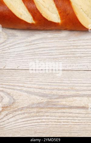 Deliciously Freshly Baked Bread skillfully displayed on a Beautiful Rustic Wooden Table Setting Stock Photo