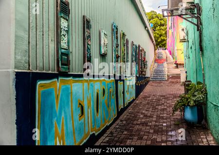 On a wall next to the Aruba Viaduct in Willemstad, collages of collector's items from Curaçao, all signed TOPO 13, hang inconspicuously on discarded window frames. Willemstad, Curaçao, Curacao, Kòrsou Stock Photo