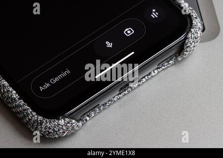The user interface of the Gemini app is seen on the screen of a Google Pixel smartphone. Gemini is a generative AI chatbot developed by Google. Stock Photo
