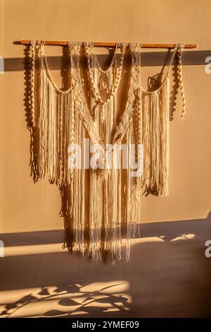 Macrame curtains in the evening light Stock Photo