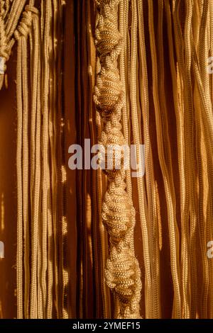 Macrame curtains in the evening light Stock Photo