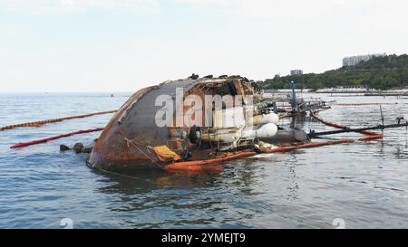 Broken rusty oil tanker ship in the shallow water after the wreck. Close up view from the drone Stock Photo