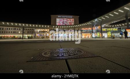 Central station of Graz, manhole cover with coat of arms, night shot, Graz, Styria, Austria, Europe Stock Photo