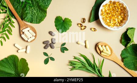 Vegan vitamin capsules for immunity support and healthy lifestyle on light beige background. Natural softgels and pills supplements and various green Stock Photo