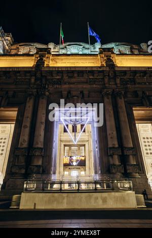 Milan, Italy - August 19, 2024: The facade of Milano Centrale station at night Stock Photo