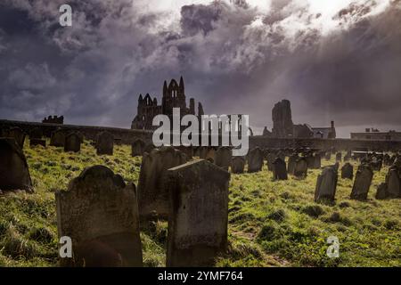 Sunshine breaks through stormy clouds at Whitby Abbey, England. Stock Photo