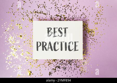 White sign with the word Best Practice written on it. The sign is surrounded by gold glitter Stock Photo