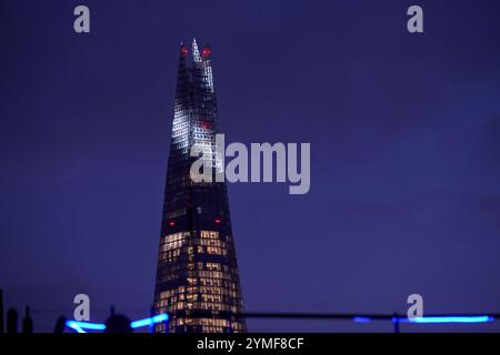 The view from the Ned Hotel in London of St Pauls, City Hall and various iconic london landmark including the Shard. Later Winter Afternoon in dark Stock Photo