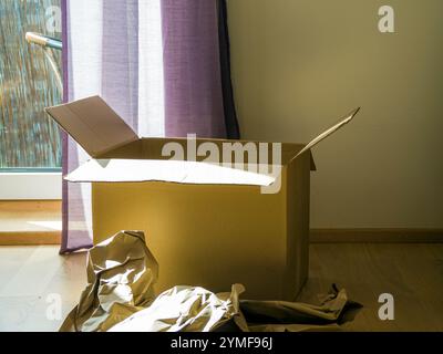 Close-up of opened carton boxes moving into new home. High quality photo Stock Photo