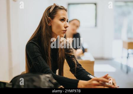 Engaged high school students participating in an interactive classroom discussion Stock Photo