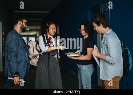 Students engaging in a lively discussion with their professor Stock Photo