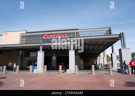 Images of a bustling Costco store featuring the exterior, entrance, and checkout areas, capturing customers and carts in action. Stock Photo