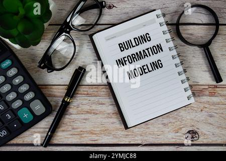 Building Information Modeling (BIM) text on notepad, Business and Financial concept background Stock Photo