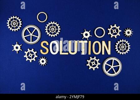 Solution alphabet letters with gears element on navy blue background Stock Photo