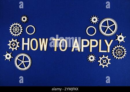 How to Apply alphabet letters with gears element on navy blue background Stock Photo