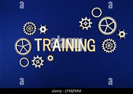 Training alphabet letters with gears element on navy blue background Stock Photo