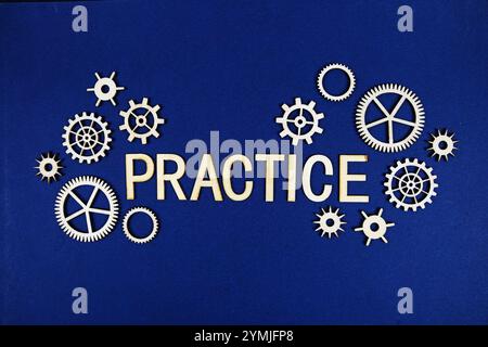 Practice alphabet letters with gears element on navy blue background Stock Photo