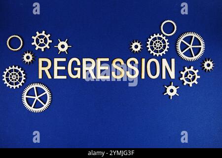 Regression alphabet letters with gears element on navy blue background Stock Photo