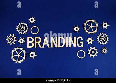 Branding alphabet letters with gears element on navy blue background Stock Photo