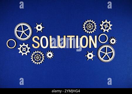 Solution alphabet letters with gears element on navy blue background Stock Photo