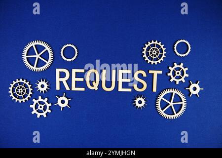 Request alphabet letters with gears element on navy blue background Stock Photo