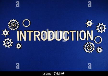 Introduction alphabet letters with gears element on navy blue background Stock Photo