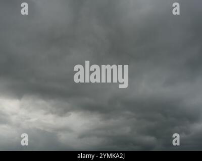 Cumulonimbus cloud formations on tropical sky , Nimbus moving , Abstract background from natural phenomenon and gray clouds hunk , Thailand Stock Photo