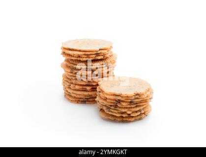 Stack  of thin round crispbreads with herbs isolated on white Stock Photo