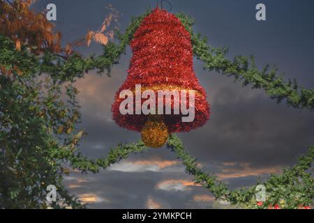 red christmas bell hanging in sky Stock Photo