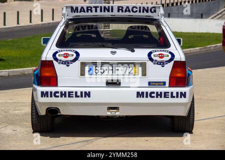 Rear view of a white lancia delta hf integrale evo showcasing martini racing, michelin, and sportline sponsorships Stock Photo