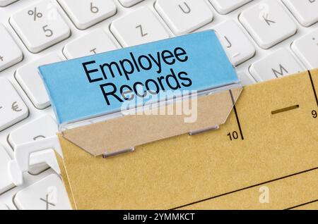 A brown file folder labeled with Employee records Stock Photo
