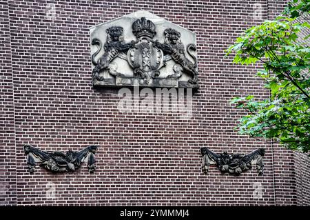 A timeless tribute: The Amsterdam coat of arms engraved on the front of a building Stock Photo