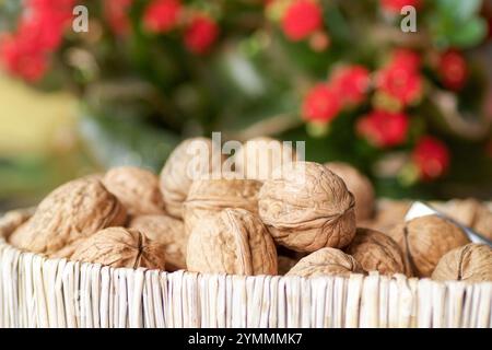 group of walnuts in a basket, blurred background Stock Photo