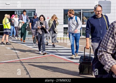 Passengers on runway waiting to board KLM Eastern flight from Teesside International Airport, Darlington, County Durham, England, UK Stock Photo
