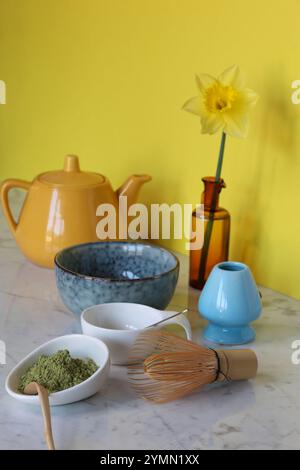 tea set for matcha on marble table, yellow background Stock Photo