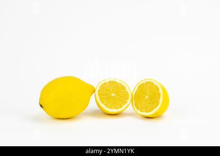 texture of lemon pulp cut in half and whole lemon on white Stock Photo