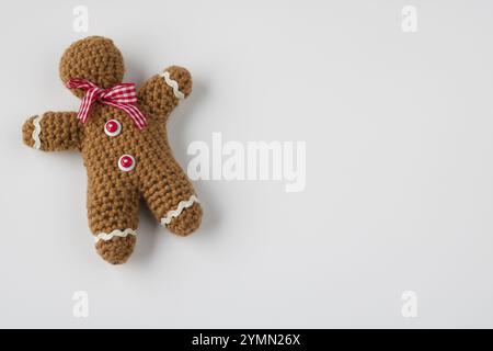 close up of gingerbread man crocheted, copy space, isolated on white Stock Photo