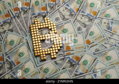 Bitcoin symbol with golden cubes on 100 dollar bills. 3d illustration. Stock Photo