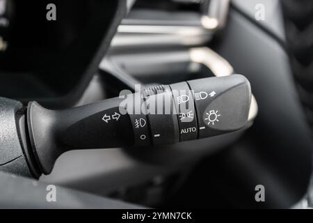 Close-up view of the car headlight switch controls. Stock Photo