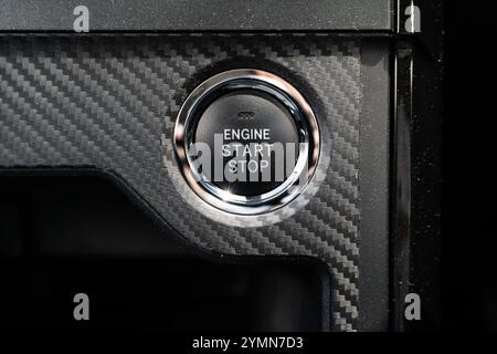 Close-up view of the engine start stop button in the car. Stock Photo