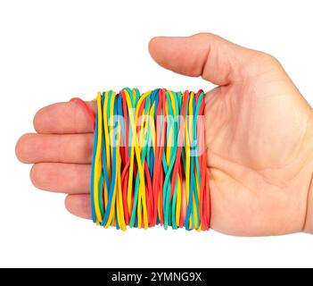 A hand grasps a collection of vibrant elastic bands in different colors, perfect for various organizing and crafting tasks. Stock Photo