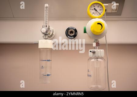 Medical Oxygen Supply System with Flowmeter and Pressure Gauge inside Hospital Room. Stock Photo