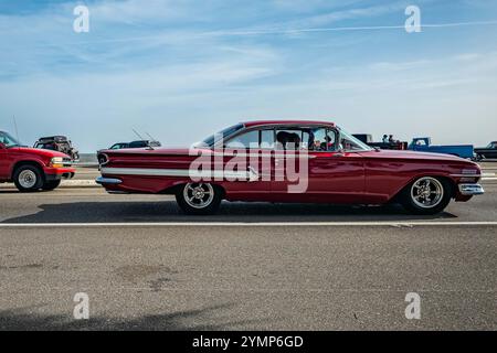 Gulfport, MS - October 04, 2023: Wide angle side view of a 1960 Chevrolet Impala Sport Coupe at a local car show. Stock Photo