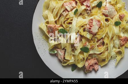 Tagliatelle pasta, in cream sauce with salmon, homemade, no people Stock Photo