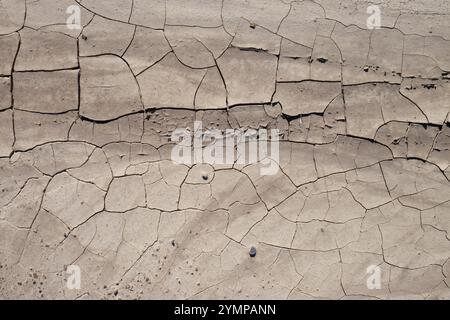 Dry cracked sandy clay dirt, overhead shot Stock Photo