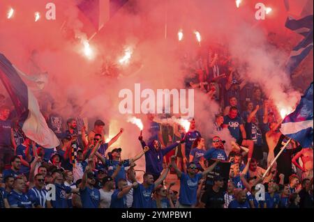 LUBIN, POLAND - AUGUST 17, 2024: Football match Polish PKO Ekstraklasa between KGHM Zaglebie Lubin vs Lech Poznan. Supporters of Lech burn flares. Stock Photo